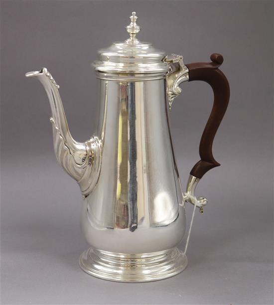 A 1960s silver coffee pot, C J Vander Ltd, gross 23.5 oz.